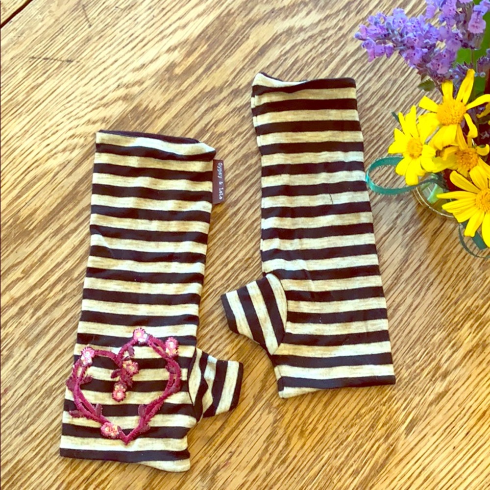 Striped hand warmers with heart appliqué
